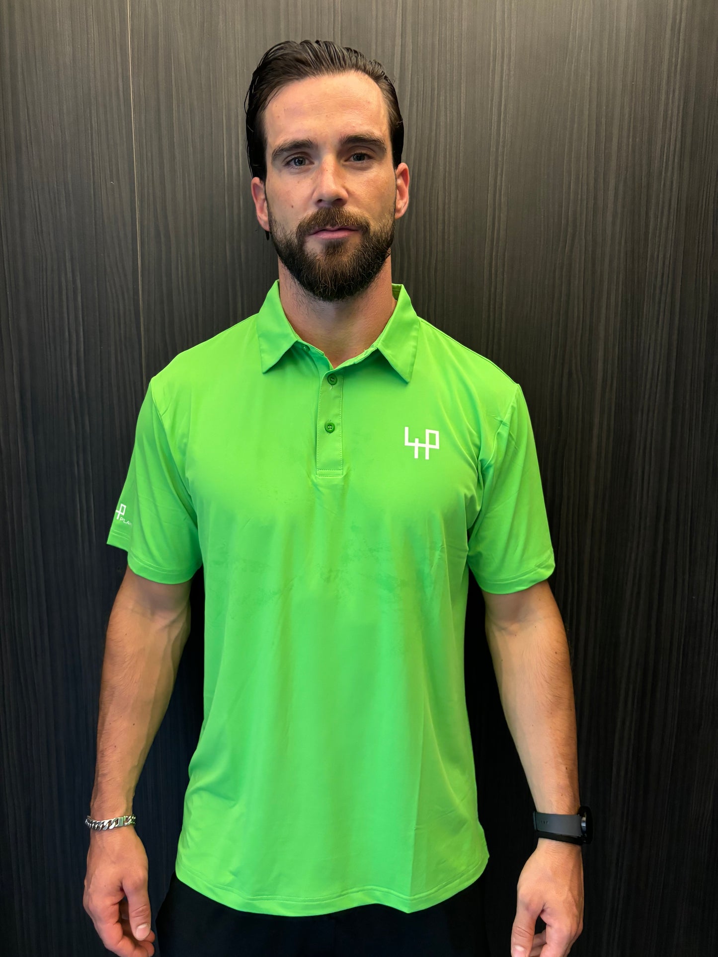 Golfer wearing Flashy Green Golf Polo Shirt on course – limited edition athletic fit by Fore Player