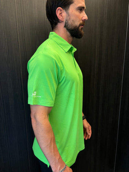 Golfer wearing Flashy Green Golf Polo Shirt on course – limited edition athletic fit by Fore Player