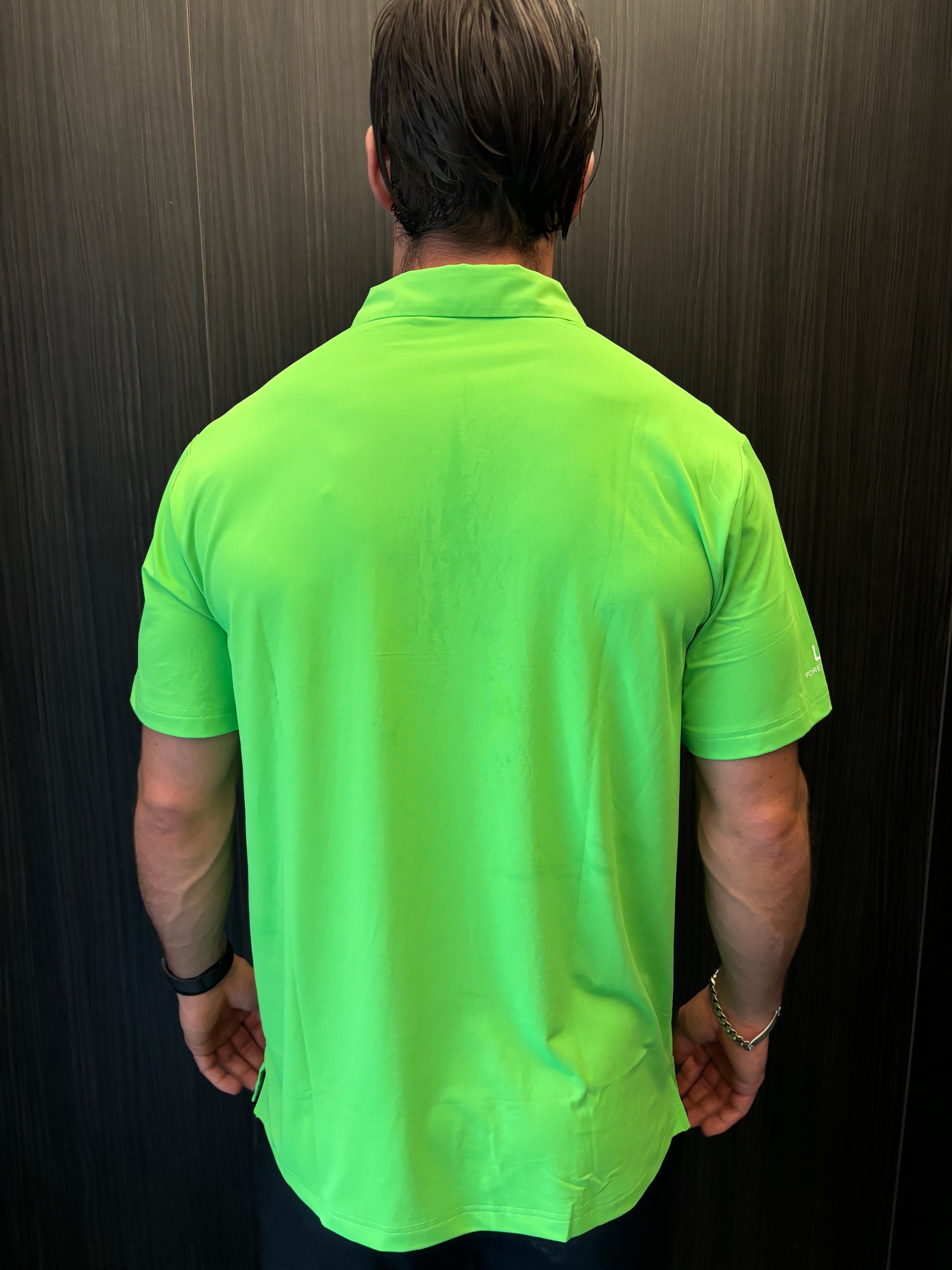 Close-up of moisture-wicking fabric on Flashy Green Golf Polo Shirt – soft, stretchable, and sweat-resistant
