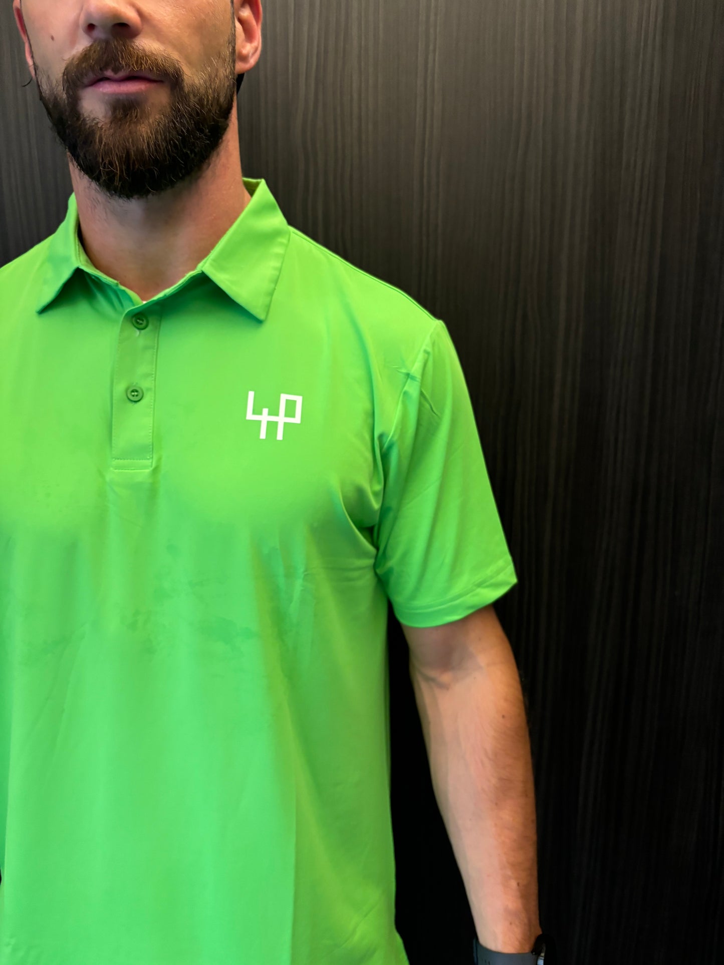 Close-up of moisture-wicking fabric on Flashy Green Golf Polo Shirt – soft, stretchable, and sweat-resistant