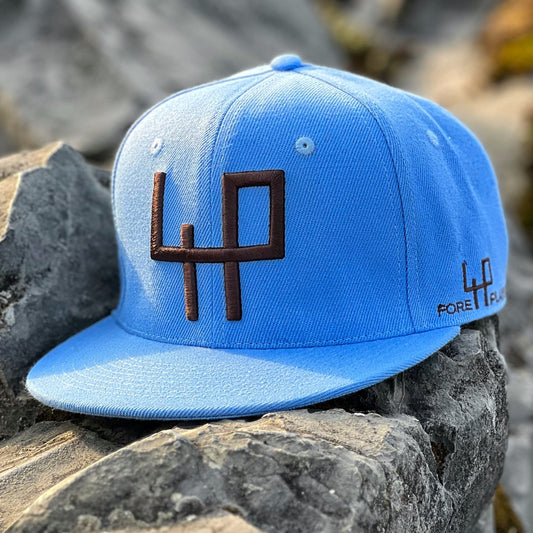 Original baseball cap style - Blue background and chocolate brown logo 